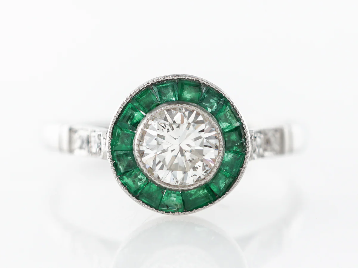 Diamond & Emerald Halo Engagement Ring in Platinum